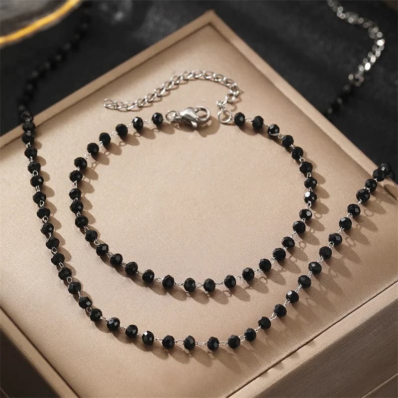 Parure collier et bracelet à perles noires et chaînes