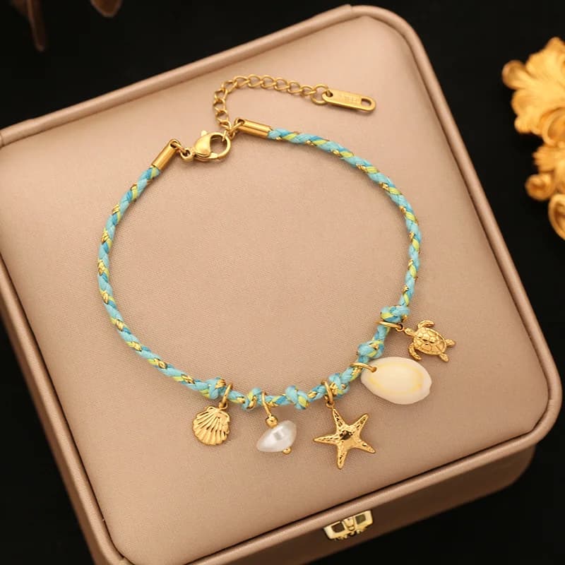 Bracelet charms étoile de mer et coquillage sur cordon