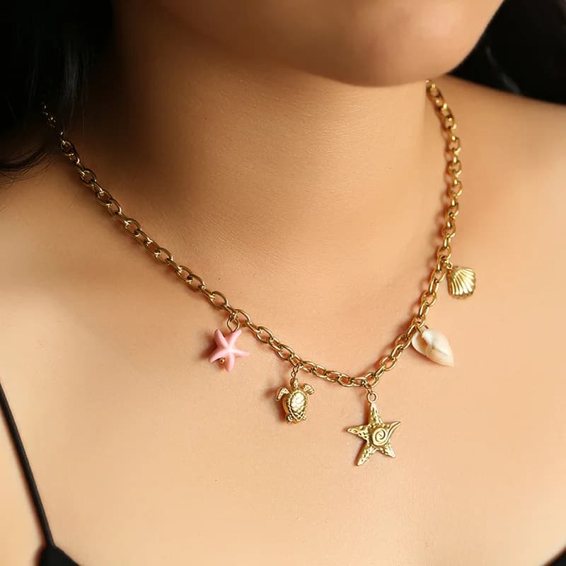 Collier pendentif étoile de mer et tortue doré