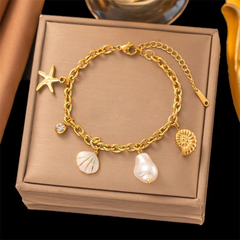 Bracelet charms étoile de mer et coquillage sur cordon