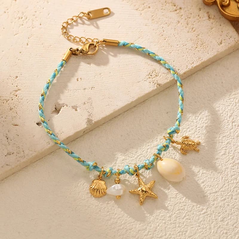 Bracelet charms étoile de mer et coquillage sur cordon