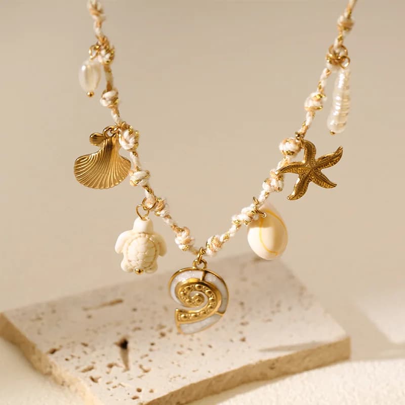 Collier pendentif perle conque océanique