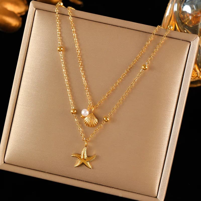 Collier à double chaîne avec pendentifs étoile de mer et coquillage, doré