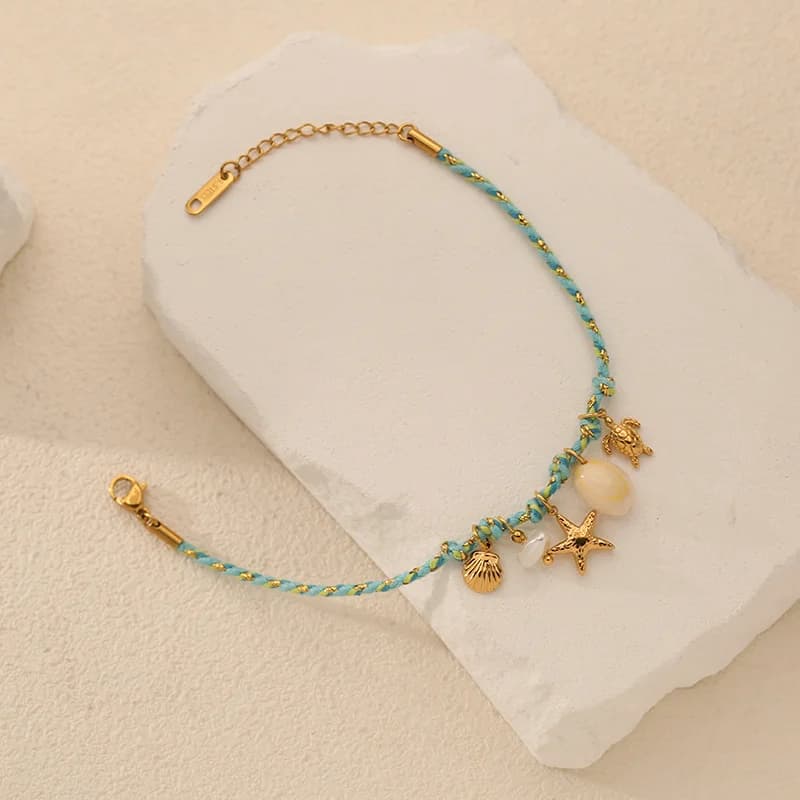 Bracelet charms étoile de mer et coquillage sur cordon
