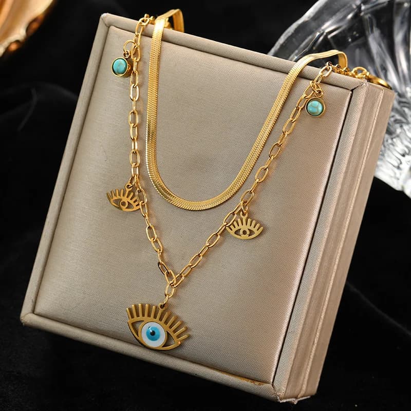 Collier à plusieurs rangs avec pendentif yeux bleus