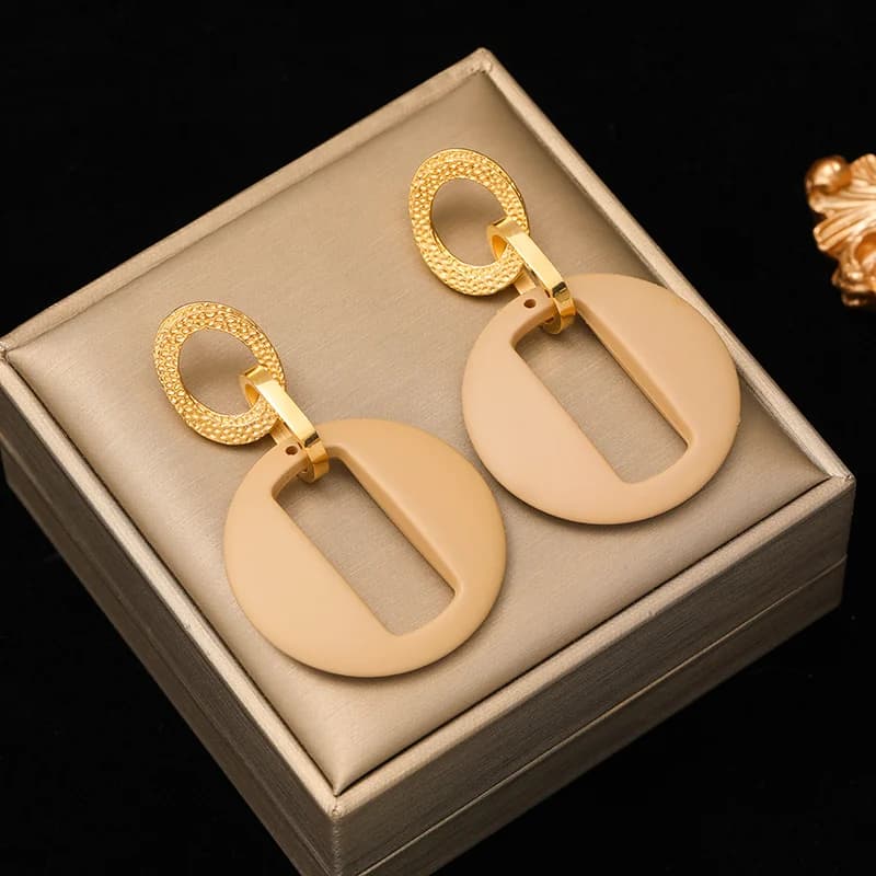 Boucles d'oreilles à clous soleil exagéré en résine et acier inoxydable